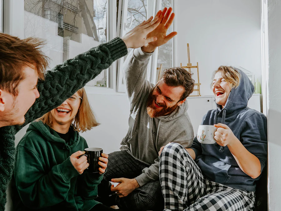 Friends laughing over coffee in a bright room
